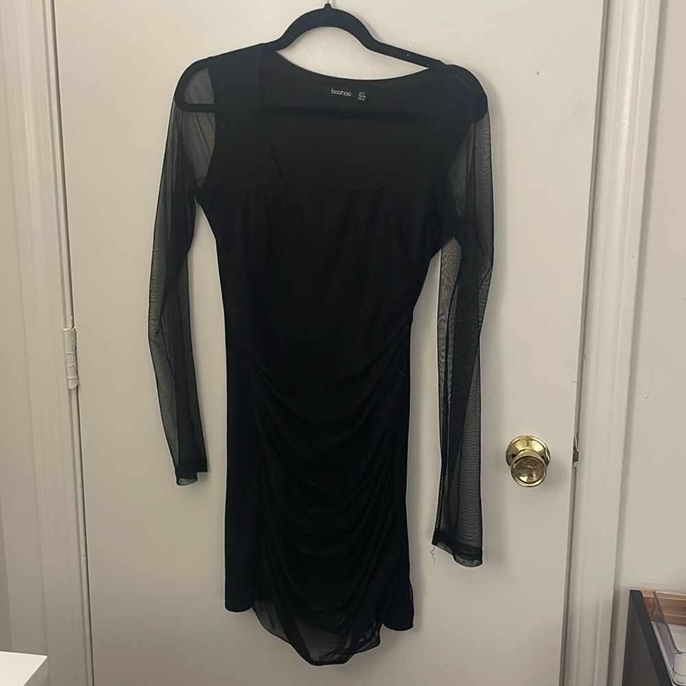 Little black dress with mesh sleeves
